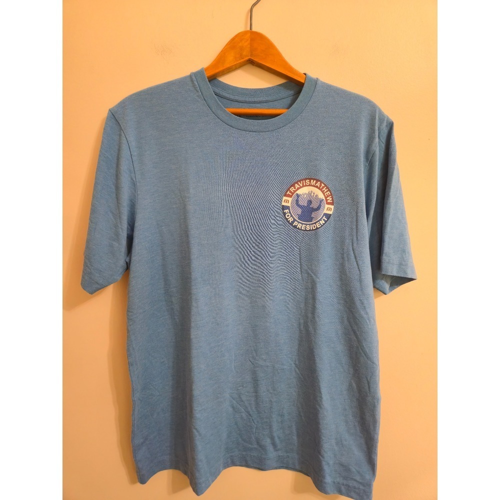 TravisMathew For President T-Shirt Mens‎ M Blue Graphic Crest Golf Logo NWOT